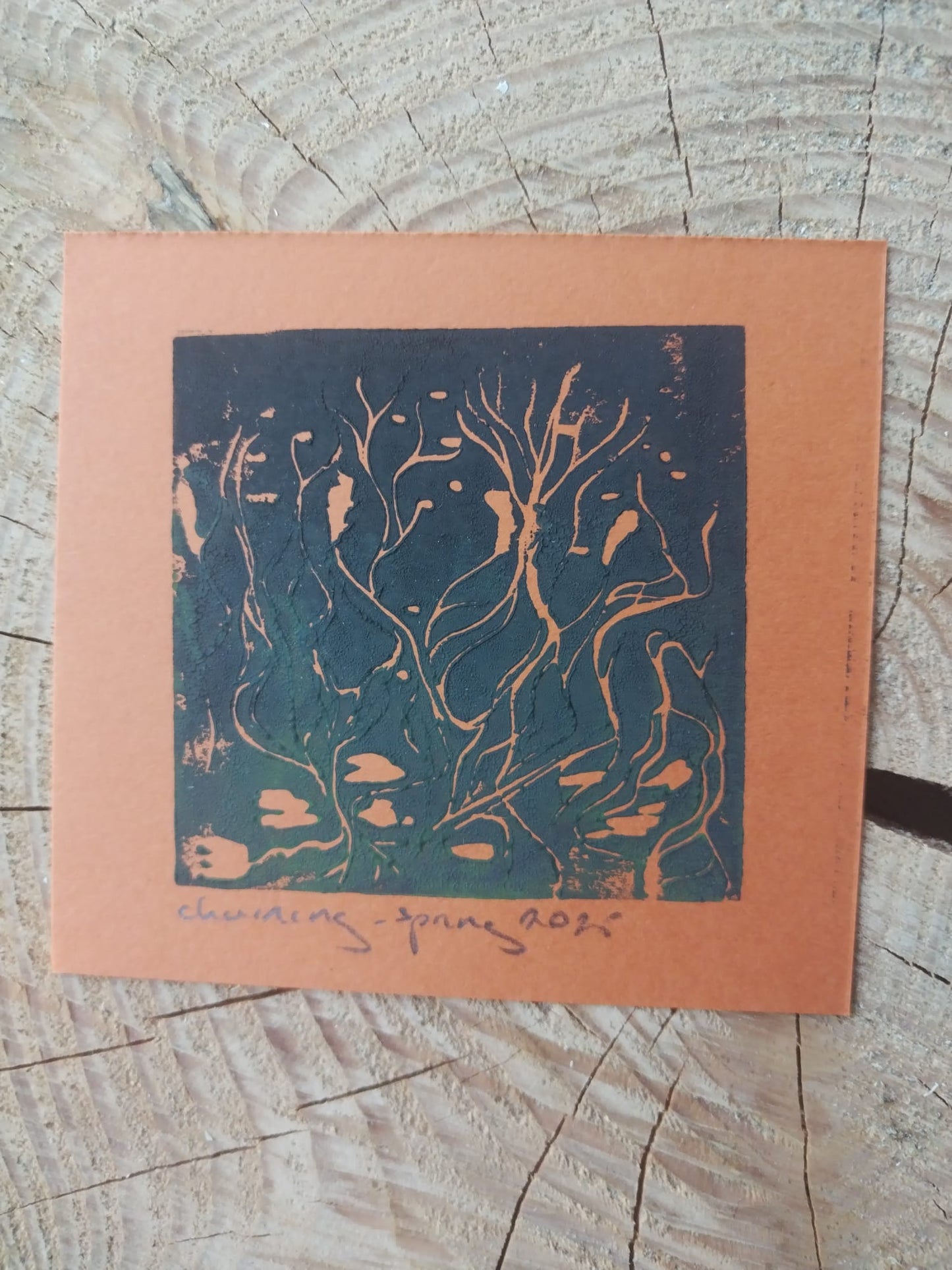 Churning print in green on an orange background