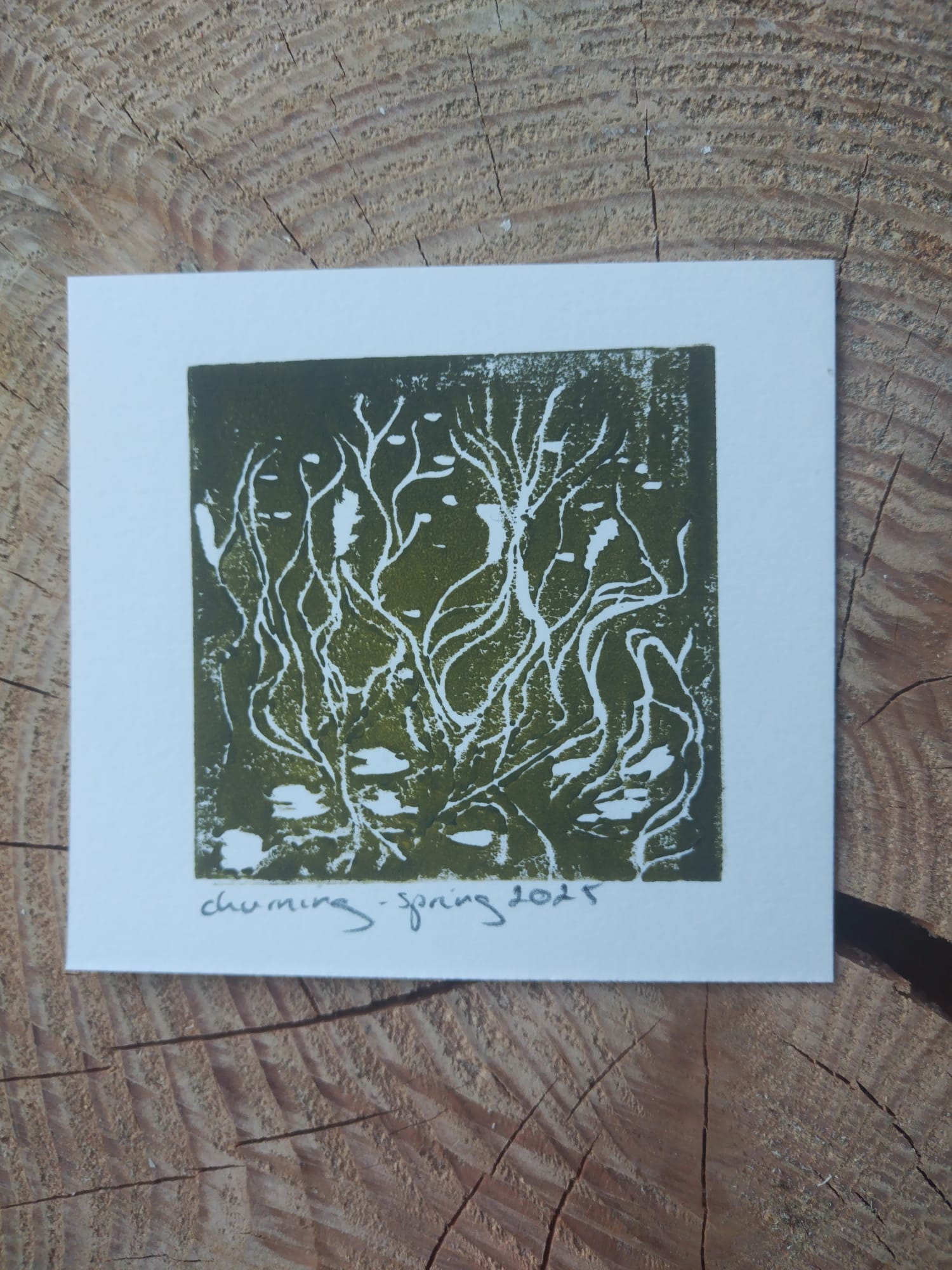 Churning print in green on a white background