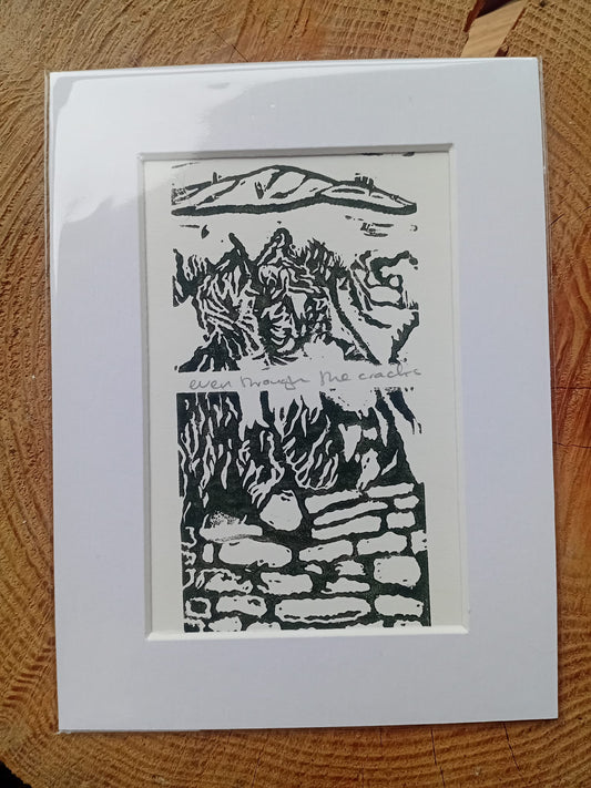 A mounted original lino print called Even Through the Cracks from Analogish. Handmade in Manchester