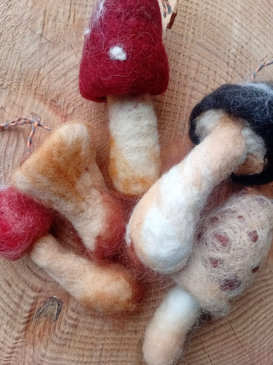 Felted mushroom on a wooden surface